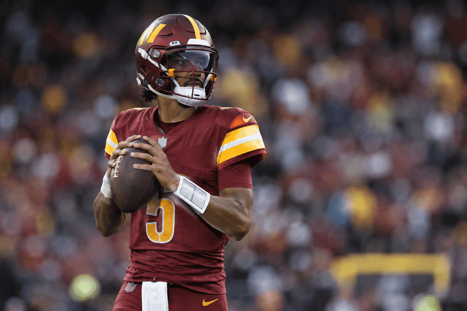 Editorial sports image for Jayden Daniels Is Delaying Elbow Surgery to Keep Playing Football