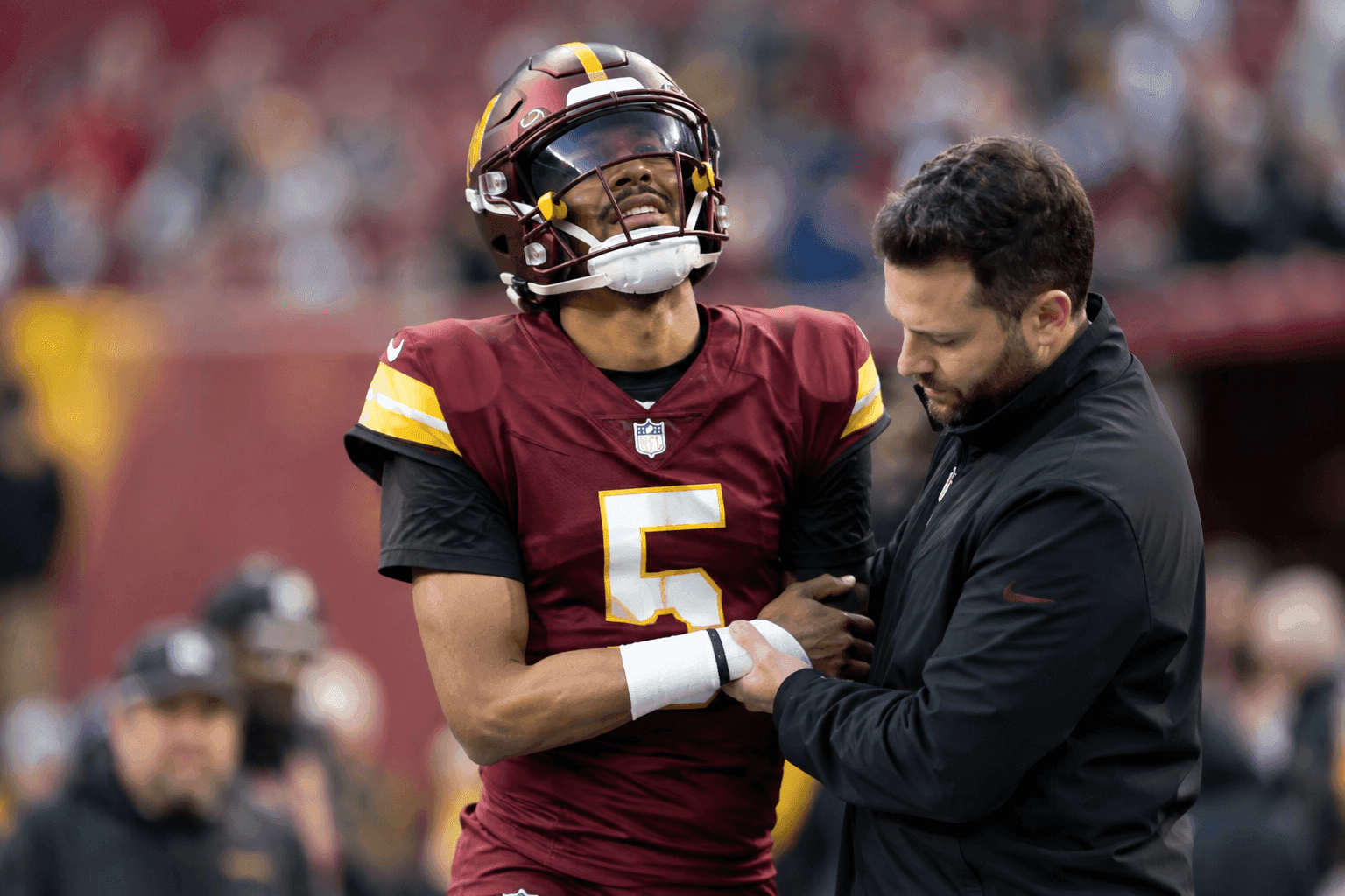 Editorial sports image for Jayden Daniels Dodges IR After Dislocating Elbow, Because Football Anatomy is Fake