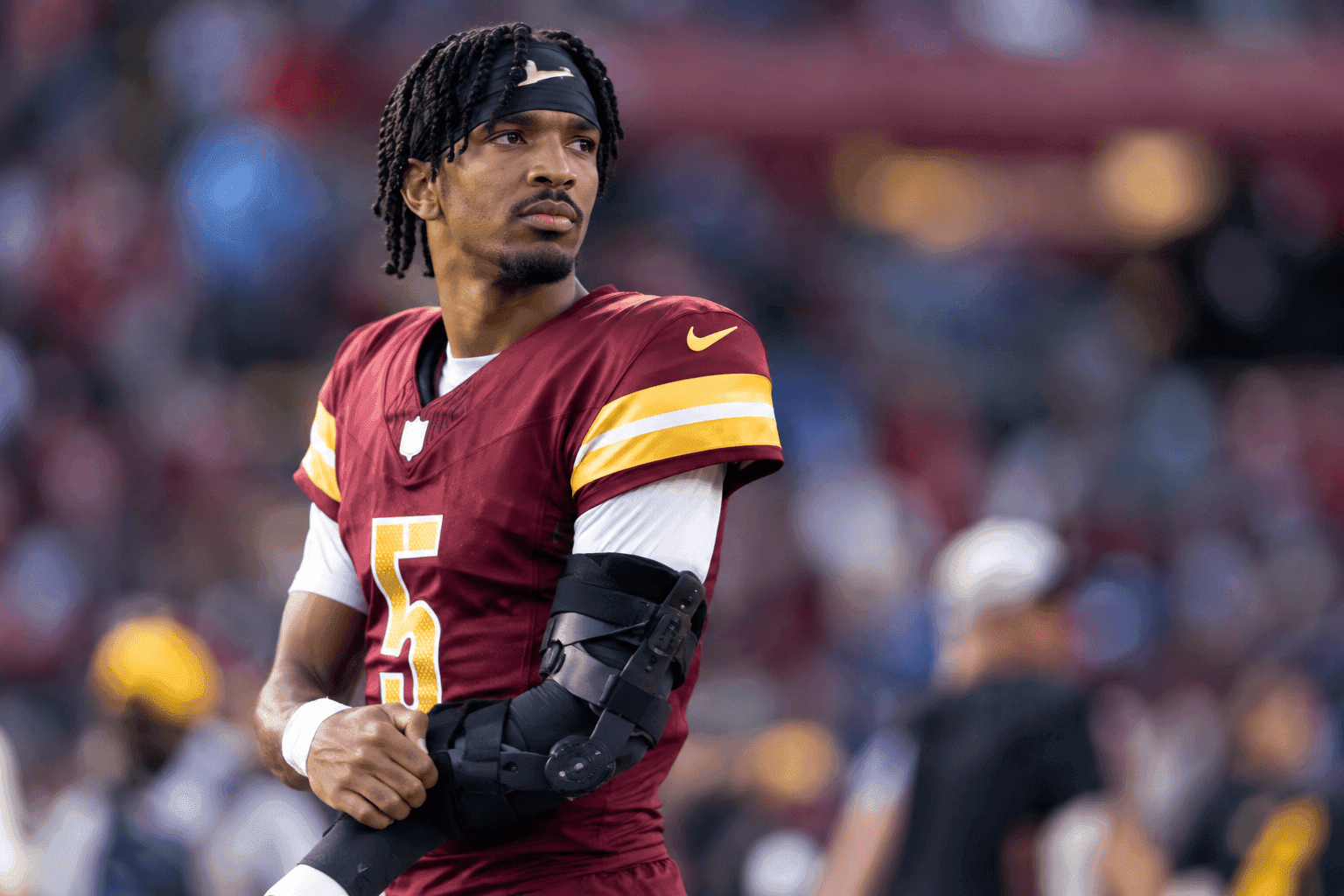 Editorial sports image for Jayden Daniels is Bracing His Elbow and Delaying Surgery, Because the NFL is a Normal Workplace