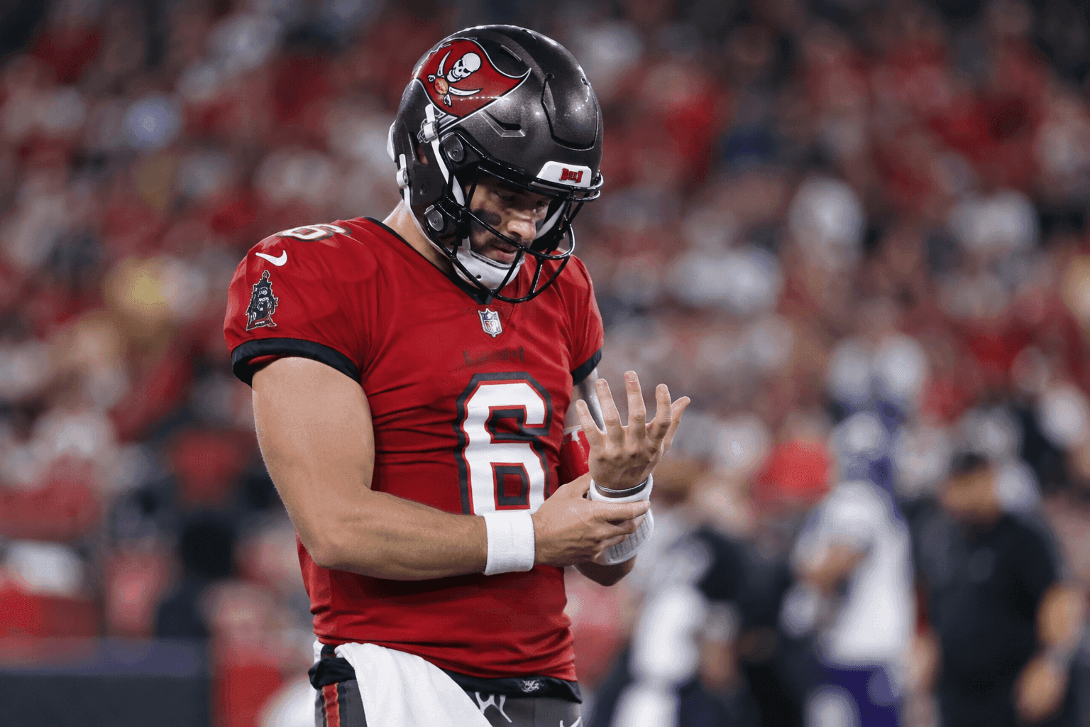 Editorial sports image for Baker Mayfield Exits With Right Hand Injury As Vikings Seal Win Over Bucs